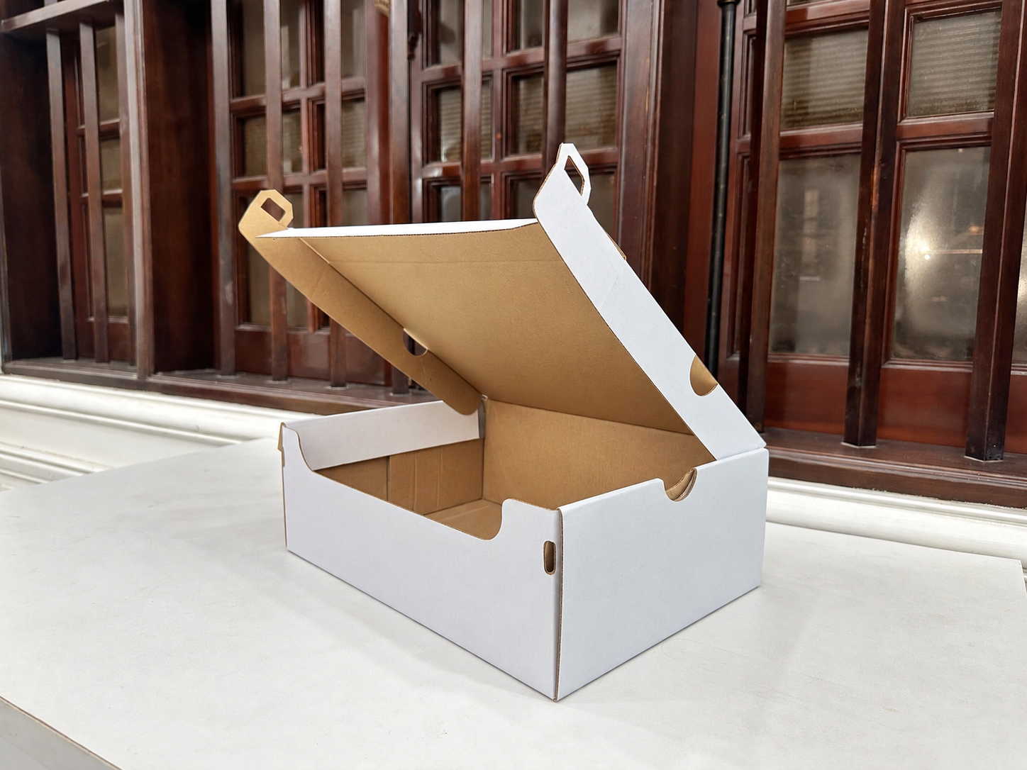 Hộp carton nắp cài bế khuôn – kiểu thùng ảnh hưởng cách tính giá thùng carton