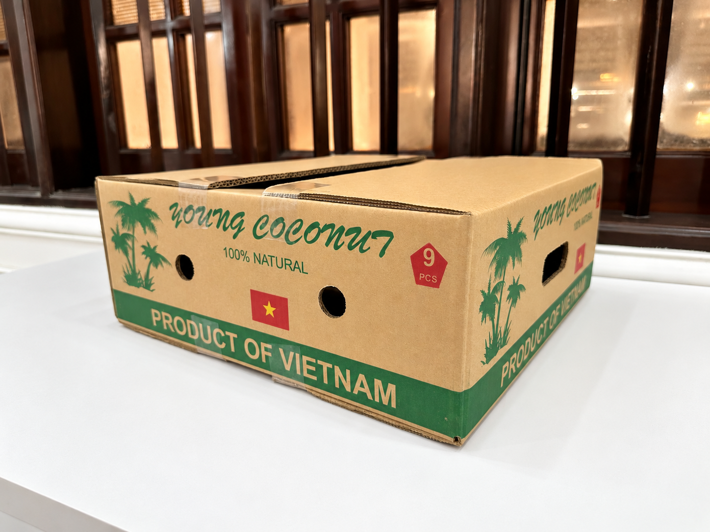 Thùng carton in Flexo 2 màu đục lỗ thông gió cho dừa xuất khẩu – ví dụ cách tính giá thùng carton có in